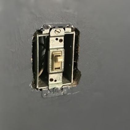 Flip light switch missing a wall plate